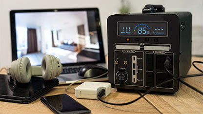 Portable power station solar electricity generator - laptop, phone, tablet and digital camera electronic devices charging. Wireless charging battery backup, power outage emergencies outdoors, camping. 